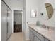 Bright bathroom featuring granite countertops, a vanity, a walk-in shower, and tile flooring at 2344 Pleasant Hill Ln, Holiday, FL 34691