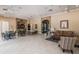 A large community space perfect for gathering with comfortable furniture and neutral tones at 2344 Pleasant Hill Ln, Holiday, FL 34691