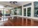 Spacious mirrored dance studio featuring hardwood floors and ample natural light at 2344 Pleasant Hill Ln, Holiday, FL 34691