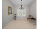 Formal dining room with neutral tones, tile floors, and a chandelier at 2344 Pleasant Hill Ln, Holiday, FL 34691