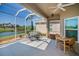 Relaxing screened lanai with lake view at 2344 Pleasant Hill Ln, Holiday, FL 34691