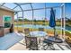 Screened lanai with views of the lake at 2344 Pleasant Hill Ln, Holiday, FL 34691