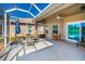 Screened lanai with ceiling fan, ideal for outdoor living at 2344 Pleasant Hill Ln, Holiday, FL 34691