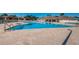 Resort style pool with chairs and a beautiful brick paver surround at 2344 Pleasant Hill Ln, Holiday, FL 34691