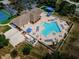 Aerial view of the community pool with inviting blue water and plenty of lounge chairs at 2344 Pleasant Hill Ln, Holiday, FL 34691