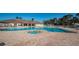 Resort-style swimming pool with a hot tub and lounge chairs in a beautiful community setting at 2344 Pleasant Hill Ln, Holiday, FL 34691