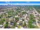 Scenic aerial shot of the property nestled in a lush, green neighborhood with a distant city skyline view at 2415 E 20Th Ave, Tampa, FL 33605