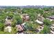 Aerial view of the property, showcasing the surrounding trees and neighborhood at 2415 E 20Th Ave, Tampa, FL 33605