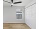 A bright bedroom with vinyl flooring, a ceiling fan and a closet at 2415 E 20Th Ave, Tampa, FL 33605