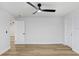 An airy bedroom featuring vinyl plank flooring, modern ceiling fan and white trim at 2415 E 20Th Ave, Tampa, FL 33605