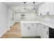 Bright kitchen features new cabinets, stylish backsplash, and modern pendant lighting at 2415 E 20Th Ave, Tampa, FL 33605