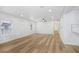 Bright, spacious living room features wood floors, recessed lighting, and modern ceiling fan at 2415 E 20Th Ave, Tampa, FL 33605