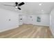 Open living area showcasing wood floors, recessed lighting, and modern white trim at 2415 E 20Th Ave, Tampa, FL 33605