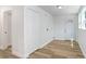 Bright room with wood-look flooring and neutral paint with exterior access at 2415 E 20Th Ave, Tampa, FL 33605
