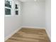 Bright room featuring wood-look flooring, neutral paint, and double windows at 2415 E 20Th Ave, Tampa, FL 33605