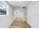 Large light-filled room featuring wood-look flooring and neutral paint at 2415 E 20Th Ave, Tampa, FL 33605