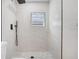 An elegant walk-in shower features modern fixtures and stylish tile work at 2415 E 20Th Ave, Tampa, FL 33605