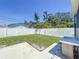 Fenced backyard featuring a concrete patio and a convenient outdoor sink area for added functionality at 2711 W Cordelia St, Tampa, FL 33607