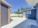 View of detached unit in backyard and patio parking area at 2711 W Cordelia St, Tampa, FL 33607