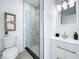 Modern bathroom with a glass-enclosed shower, a vanity with white cabinets, and modern finishes at 2711 W Cordelia St, Tampa, FL 33607