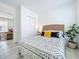 Stylish bedroom features a bed with a woven headboard and a patterned duvet at 2711 W Cordelia St, Tampa, FL 33607