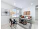Comfortable living room with a sofa, accent chairs, and a decorative rug at 2711 W Cordelia St, Tampa, FL 33607