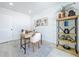 Bright office with a light wood desk, white walls, and an industrial style bookshelf at 2711 W Cordelia St, Tampa, FL 33607
