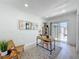 Bright office with a light wood desk, white walls, and a sliding glass door to the backyard at 2711 W Cordelia St, Tampa, FL 33607