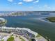 Wide aerial view showcasing a waterfront condominium complex with stunning coastline and ocean views at 280 126Th Ave # 106, Treasure Island, FL 33706