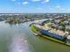 Aerial view showcasing the waterfront complex with stunning water and city views at 280 126Th Ave # 106, Treasure Island, FL 33706