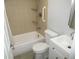 Bathroom featuring tiled shower, toilet, and vanity with sink at 280 126Th Ave # 106, Treasure Island, FL 33706