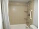 Bathroom with shower/tub combo with tiled walls and a shower curtain at 280 126Th Ave # 106, Treasure Island, FL 33706