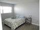 Bright bedroom with wood floors, neutral walls, and natural light at 280 126Th Ave # 106, Treasure Island, FL 33706