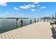 Spacious dock with seating that offers stunning waterfront views and inviting relaxation at 280 126Th Ave # 106, Treasure Island, FL 33706