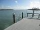 Dock features waterfront access, a ladder, and scenic views of the surrounding waterways at 280 126Th Ave # 106, Treasure Island, FL 33706