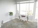Charming sunroom featuring large windows with a beautiful water view, enhancing the property's serene and picturesque setting at 280 126Th Ave # 106, Treasure Island, FL 33706