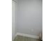Neutral wall with electrical outlet and white baseboards at 280 126Th Ave # 106, Treasure Island, FL 33706