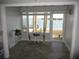 Charming sunroom featuring large windows with a beautiful water view, enhancing the property's serene and picturesque setting at 280 126Th Ave # 106, Treasure Island, FL 33706