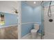 Cozy bathroom featuring shower, toilet with beadboard paneling at 3500 Gussie St, Punta Gorda, FL 33950