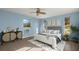 Comfortable bedroom features wood floors, neutral decor, and a light color scheme for a peaceful retreat at 3500 Gussie St, Punta Gorda, FL 33950