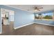 Bonus room with bright tile floors with a view into the kitchen at 3500 Gussie St, Punta Gorda, FL 33950