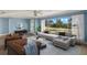 Bright living room with a large window, a comfortable couch, and stylish decor at 3500 Gussie St, Punta Gorda, FL 33950