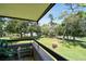 Relaxing balcony view overlooking the lush green golf course, offering a serene outdoor living space at 36750 Us 19 N # 22212, Palm Harbor, FL 34684