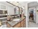 Neutral bathroom boasts granite countertop, lots of decor, and a door to an adjacent room at 36750 Us 19 N # 22212, Palm Harbor, FL 34684