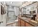 Updated bathroom with a granite countertop and a glass enclosed shower at 36750 Us 19 N # 22212, Palm Harbor, FL 34684