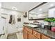 Elegant bathroom featuring granite countertops, decorative mirror, and tiled walls at 36750 Us 19 N # 22212, Palm Harbor, FL 34684