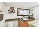 Granite countertop, decorative mirror, and wall decor in this bathroom at 36750 Us 19 N # 22212, Palm Harbor, FL 34684