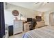 Bedroom with a computer workstation, a dresser, and a comfortable bed at 36750 Us 19 N # 22212, Palm Harbor, FL 34684