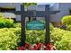 Community sign for Royal Aberdeen Lodge 22 surrounded by lush green landscaping and colorful flowers at 36750 Us 19 N # 22212, Palm Harbor, FL 34684