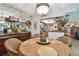 Well lit dining space leads to open concept kitchen with tile flooring at 36750 Us 19 N # 22212, Palm Harbor, FL 34684